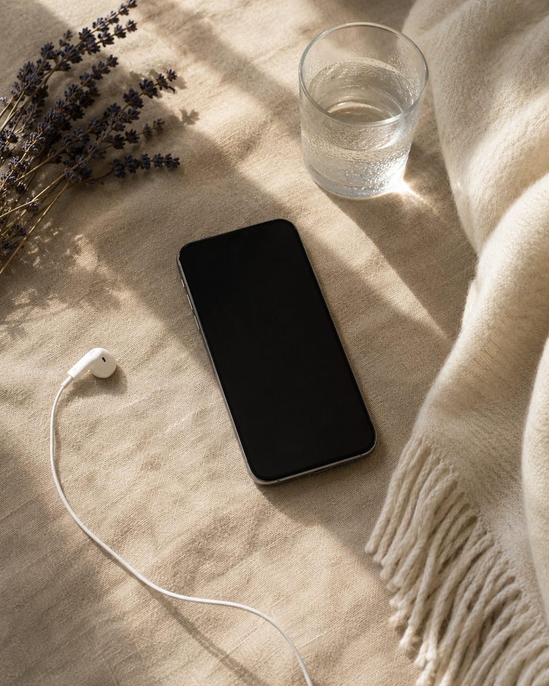 Phone, water, and blanket prepared for a distant healing session